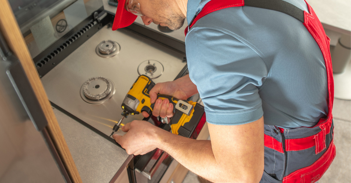 plumber installing appliance